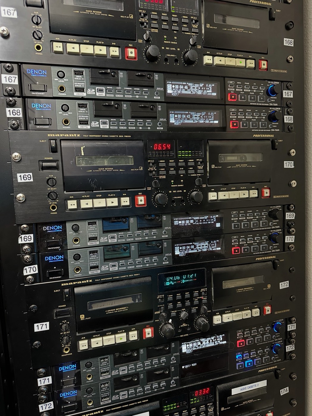 Rack of Denon and Marantz professional audio decks