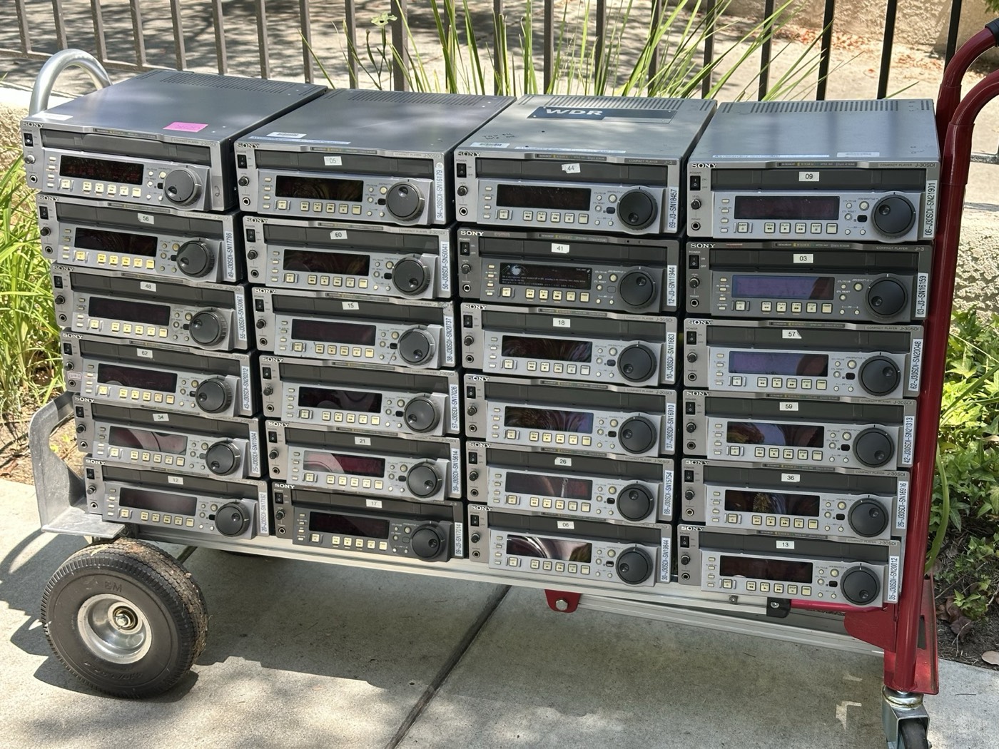 Hand truck loaded with 24 Sony J-30SDI compact players